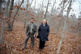 Suffolk County Legis. Kate Browning and legislative aide Joshua Slaughter walk through next to the county farm in Yaphank on Nov. 19, 2015. (Credit: James Carbone)